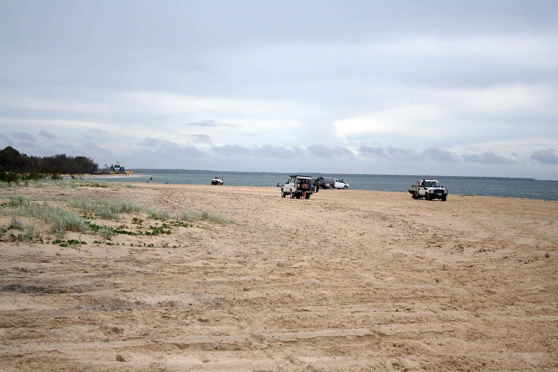 Four-wheel drives parked on the sand at Inskip Point